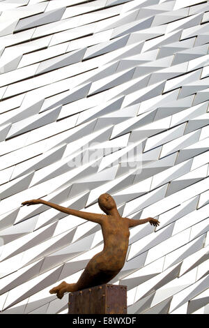 Bronze sculpture Titanica in front of the exterior of the Titanic building housing a museum to BelfastÆs maritime heritage, Belfast. Northern Ireland Stock Photo