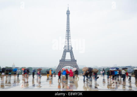 Eiffel tower in Paris with tourists and rain from Trocadero Stock Photo