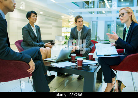 Business people talking in meeting in office building Stock Photo