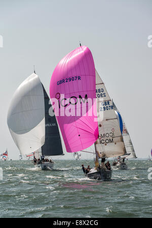 Icom yacht Cool Blue seems to be leading the pack as they race downwind during the 2014 Cowes Week Regatta Stock Photo