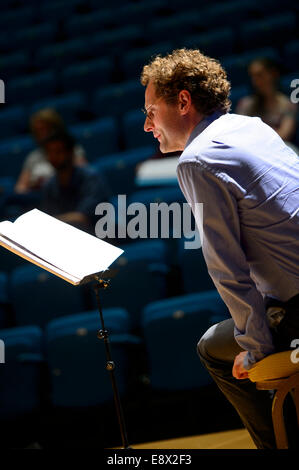 Conductor Toby Purser leading a conducting workshop class at Aberystwyth Arts Centre's MusicFest 2014 Stock Photo