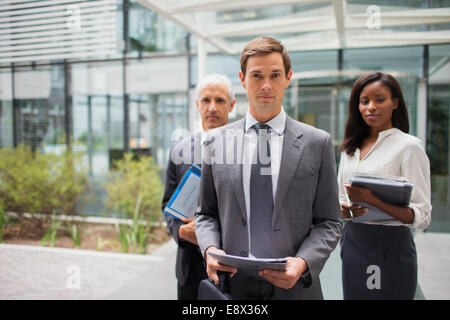 Business people outside of office building Stock Photo