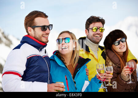 Friends enjoying drinks together Stock Photo