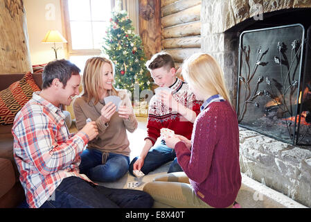 Family playing card game together Stock Photo
