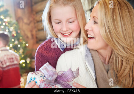 Family exchanging gifts on Christmas Stock Photo