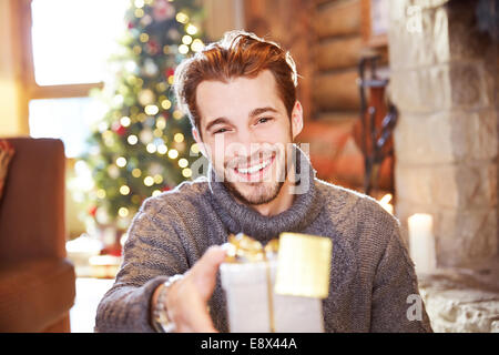 Man offering gifts on Christmas Stock Photo