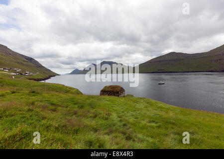 Kunoy village, Kunoy island and Kalsoy island on the right Stock Photo