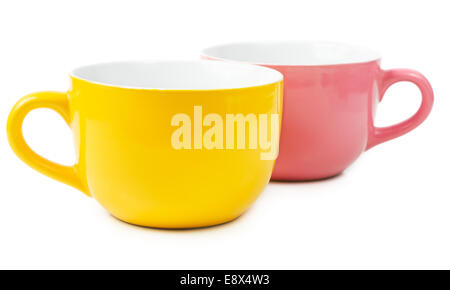 Yellow and purple mugs isolated on white background Stock Photo