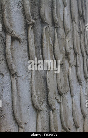 Textured stone wall in gaden at home, Thailand. Stock Photo