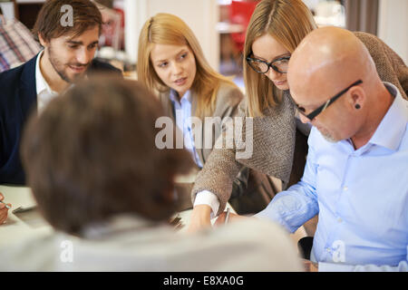 Group of business partners in casual having meeting in office Stock Photo
