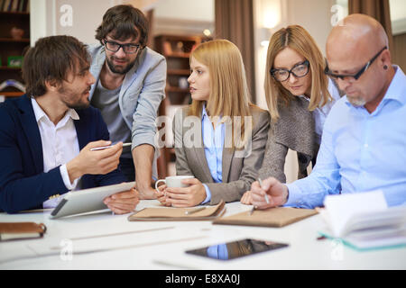 Group of confident young designers working in office Stock Photo