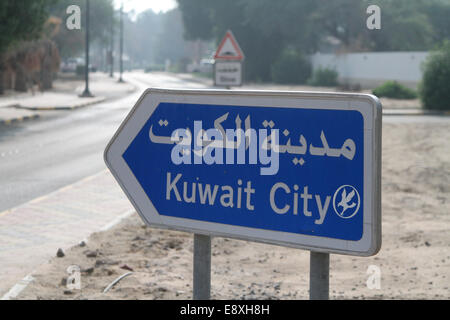 Road sign to Kuwait City, in Ahmadi, Kuwait Stock Photo