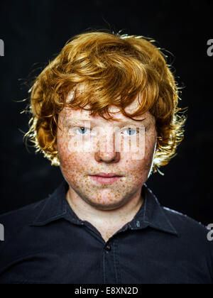 Fat freckled boy studio portrait in dark background Stock Photo - Alamy