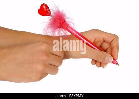 Hands writing on white paper Stock Photo