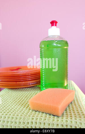 Dishwashing liquid and clean plates Stock Photo