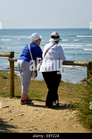 older women looking out to sea Stock Photo