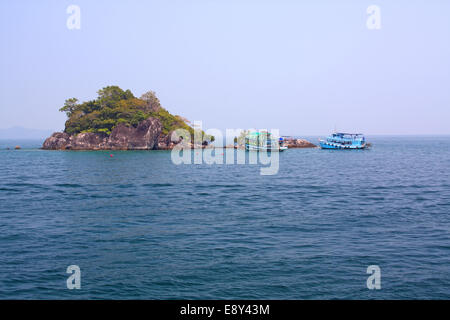 Tourist Boats near rocky island in Thailand Stock Photo
