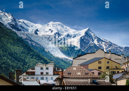 Mont Blanc above the rooftops of Chamonix, French Alps, Savoy, France, Europe with the Glacier des Bossons Stock Photo
