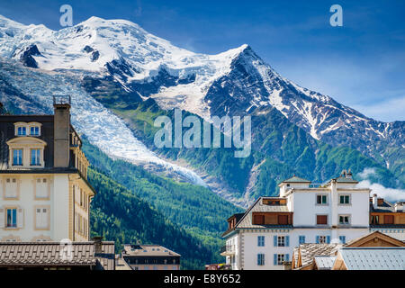 Chamonix, French Alps in summer, France - Glacier des Bossons and Mont Blanc summit above the rooftops Stock Photo