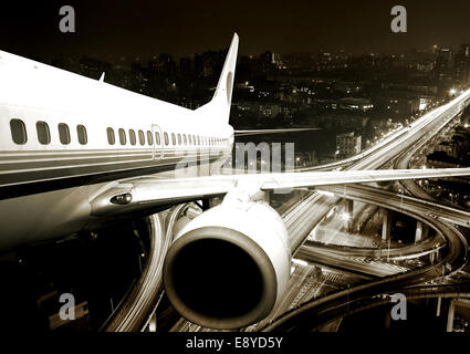 the airplane take off from the city night. Stock Photo