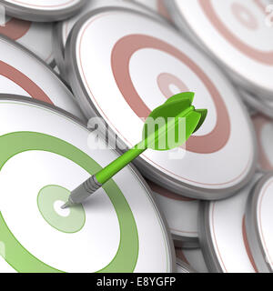 One dart hitting the center of a modern dartboard, targets concept to illustrate Business options or Marketing strategies. Stock Photo