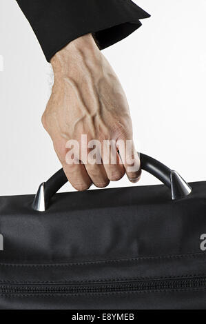 hand of man carrying a briefcase, vertical image Stock Photo