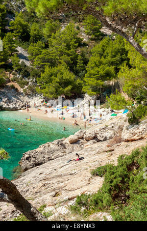 Tourists in Lucisca bay near Sveta Nedilja village, Hvar island, Croatia Stock Photo