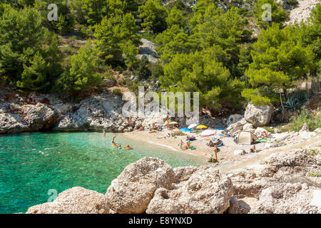 Tourists in Lucisca bay near Sveta Nedilja village, Hvar island, Croatia Stock Photo