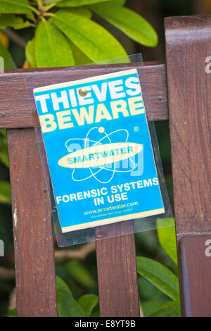 Thieves beware sign on a church door with the use of Smartwater Stock ...