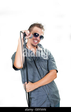 Young caucasian singer wearing sunglasses on the white background Stock Photo