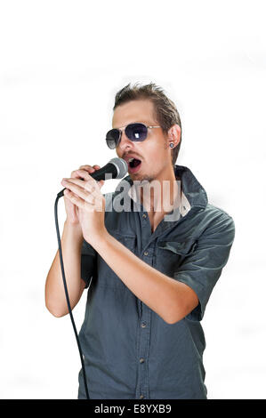 Young european singer wearing sunglasses on the white background Stock Photo