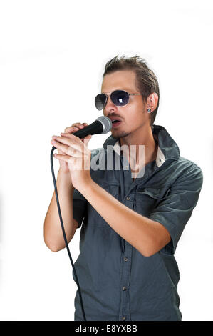 Young caucasian singer wearing sunglasses on the white background Stock Photo