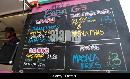 London UK. 16th October 2014. On a warm autumn afternoon people buy lunch from KERB street food vans outside UAL University of the Arts in Kings Cross.  KATHY DEWITT/Alamy Live News Stock Photo