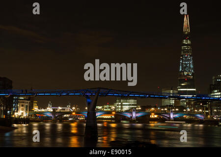 Millennium Bridge at night with The Shard in the background. Stock Photo