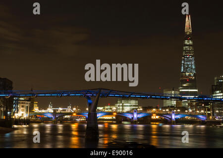 Millennium Bridge at night with The Shard in the background. Stock Photo