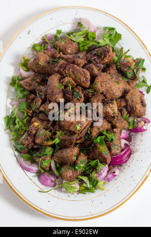 Albanian Liver, a traditional Turkish spiced lamb's liver recipe popular throughout the Middle East, high angle Stock Photo