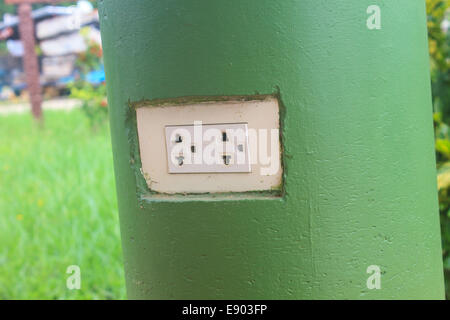 plug the power electrical mounted on stone poles Stock Photo