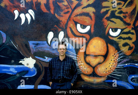 Ray Manzarek keyboardist of the classic rock band The Doors in front of mural in Venice Beach during filming of  music video for the song L.A. Woman. Stock Photo