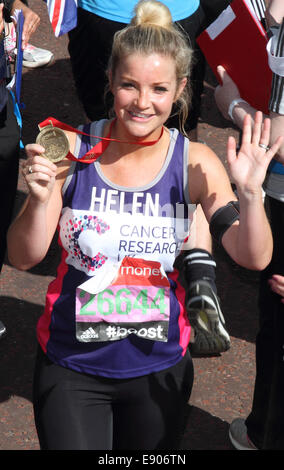 Helen Skelton with medal at the finishing line of the Virgin Money