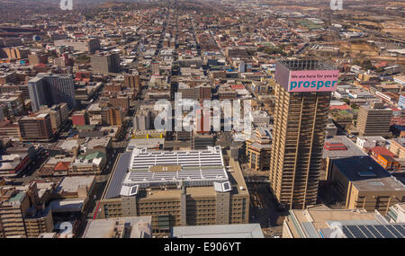 JOHANNESBURG, SOUTH AFRICA - Skyscraper in central business district, with billboard reading: We are here for you to prosper.' Stock Photo