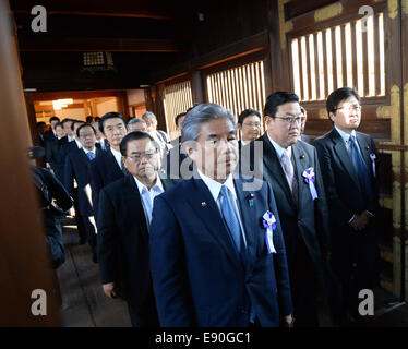 Tokyo, Japan. 17th Oct, 2014. Japanese lawmakers visit the Yasukuni Shrine in Tokyo Oct. 17, 2014. A total of 110 Japanese lawmakers from a nonpartisan group visited the Yasukuni Shrine Friday morning, which honors convicted World War II Class-A war criminals along with war dead. Credit:  Ma Ping/Xinhua/Alamy Live News Stock Photo