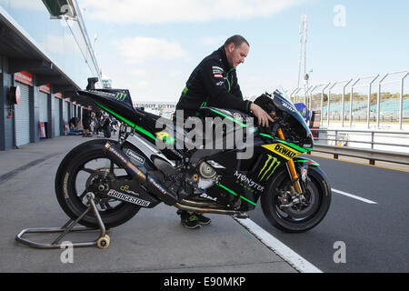 Phillip Island, Australia. 17th October, 2014. A Yamaha Tech 3 team mechanic warms up Pol Espargaro's MotoGP bike prior to start of free practice at the Australian Motorcycle Grand Prix. Credit:  Russell Hunter/Alamy Live News Stock Photo