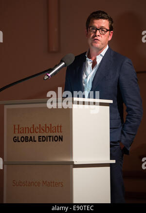 Berlin, Germany. 16th Oct, 2014. Former German Minister for Economics and Minister of Defence and current chairman of Spitzberg Partners LLC, Karl-Theodor zu Guttenberg, speaks during the 'Handelsblatt Global Edition' on 'Trans-Atlantic Crisis Management: Dialogue or Destructive Disharmony?' in Berlin, Germany, 16 October 2014. The Handelsblatt magazine appeared with an english title page for the first time today as an hommage to the english digital edition. © dpa picture alliance/Alamy Live News Stock Photo