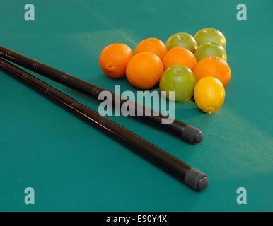 Fruits on billiards table Stock Photo