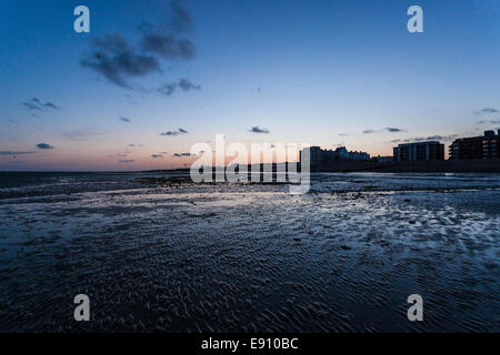 Low tide and twilight in Worthing, West Sussex, UK Stock Photo