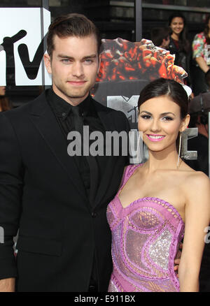 The 23rd Annual MTV Movie Awards at Nokia Theatre on April 13, 2014 in Los Angeles, California.  Featuring: Victoria Justice,Ryan Rottman Where: Los Angeles, California, United States When: 14 Apr 2014 Stock Photo