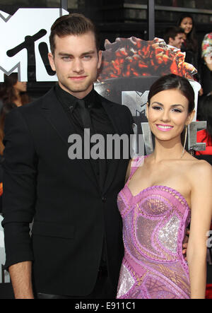 The 23rd Annual MTV Movie Awards at Nokia Theatre on April 13, 2014 in Los Angeles, California.  Featuring: Victoria Justice,Ryan Rottman Where: Los Angeles, California, United States When: 14 Apr 2014 Stock Photo