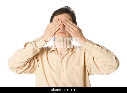 A man covering his eyes with his hands Stock Photo