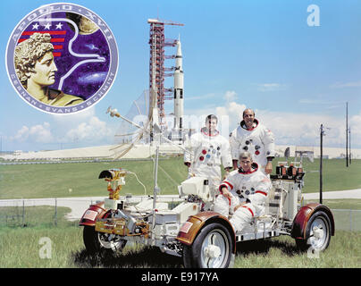 (September 30, 1972) The prime crew for the Apollo 17 lunar landing mission are: Commander, Eugene A. Cernan (seated), Command Module pilot Ronald E. Evans (standing on right), and Lunar Module pilot, Harrison H. Schmitt. They are photographed with a Lunar Roving Vehicle (LRV) trainer. Cernan and Schmitt will use an LRV during their exploration of the Taurus-Littrow landing site. The Apollo 17 Saturn V Moon rocket is in the background. This picture was taken at Pad A, Launch Complex 39, Kennedy Space Center (KSC), Florida, The Apollo 17 emblem is in the photo insert at upper left. Apollo 17 la Stock Photo