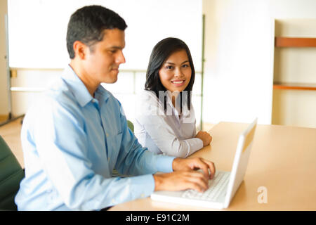 Asian And Hispanic Business Meeting Stock Photo